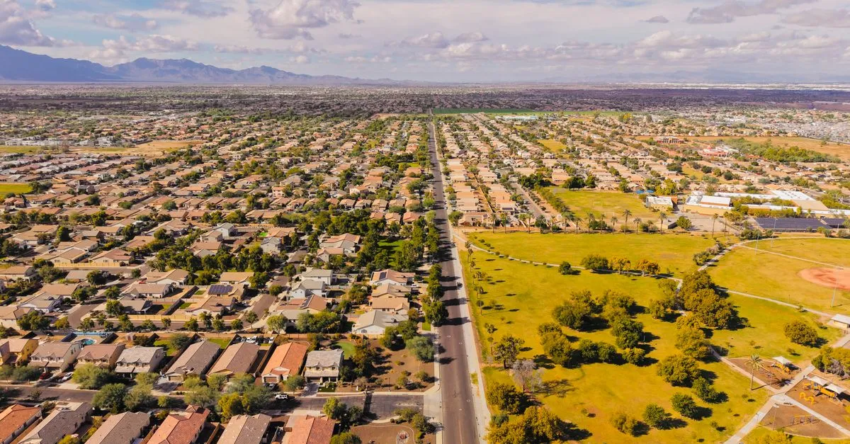 Stunning aerial view of a suburban neighborhood in Arizona with clear skies.